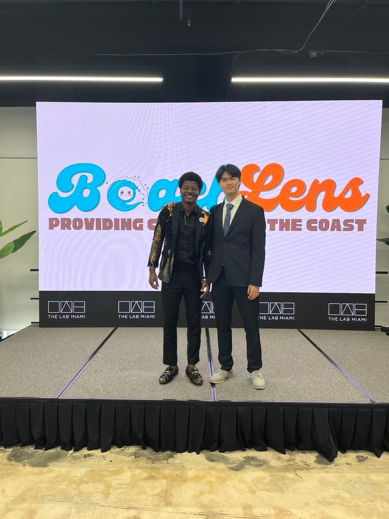 Kenzo and his co-founder presenting BeachLens on stage at The Lab Miami.